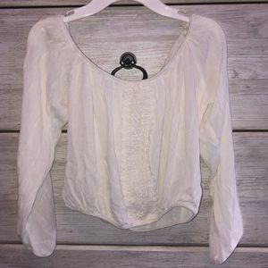 A white cropped blouse like shirt